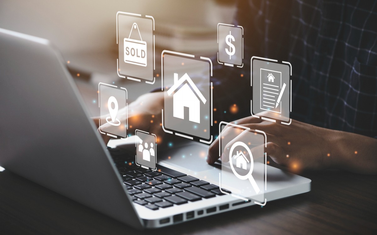 Businessman using a computer for property sales & listings, Real Estate Agent agency & contractor