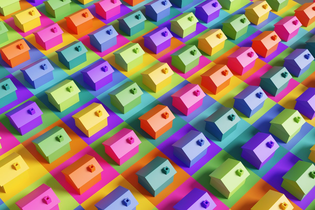 Array of rows of colourful toy houses on a multi-colored background
