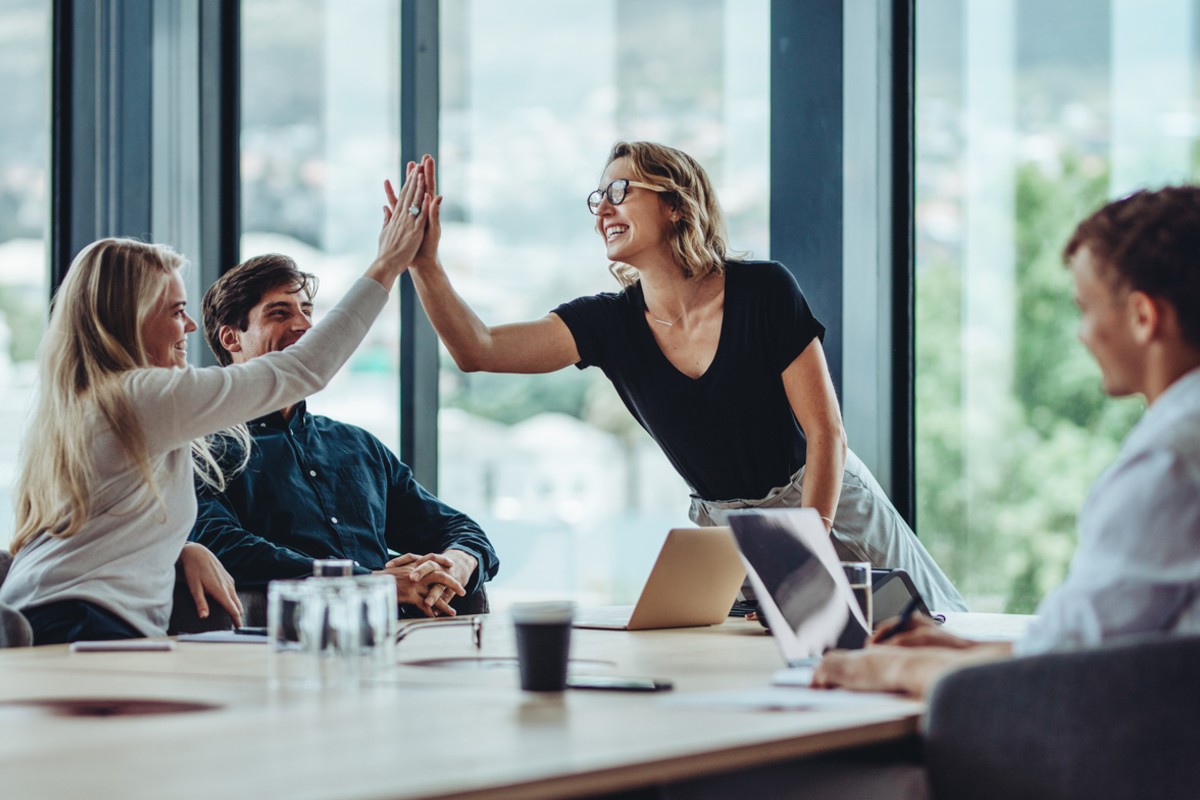 Why Your Website Is the Most Important Hire Your Estate Agency Will Make 1 Group of colleagues celebrating success